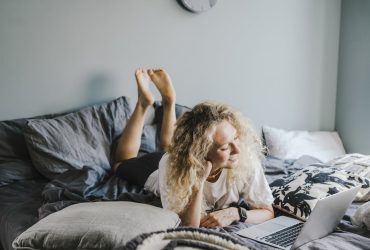 Woman over 45 using AI in job search to land a remote web design position